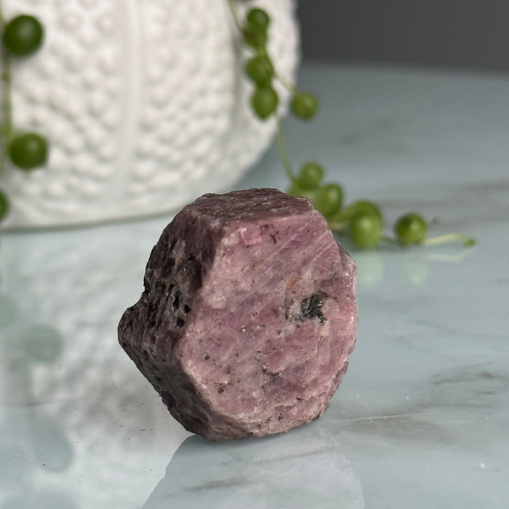 Ruby hexagon crystal specimen under UV light