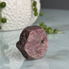Ruby hexagon crystal specimen under UV light
