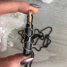 Black tourmaline wrapped in gold wire on a black chain necklace – Wholehearted Crystal Creations