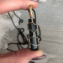 Black tourmaline wrapped in gold wire on a black chain necklace – Wholehearted Crystal Creations