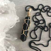 Black tourmaline wrapped in gold wire on a black chain necklace – Wholehearted Crystal Creations