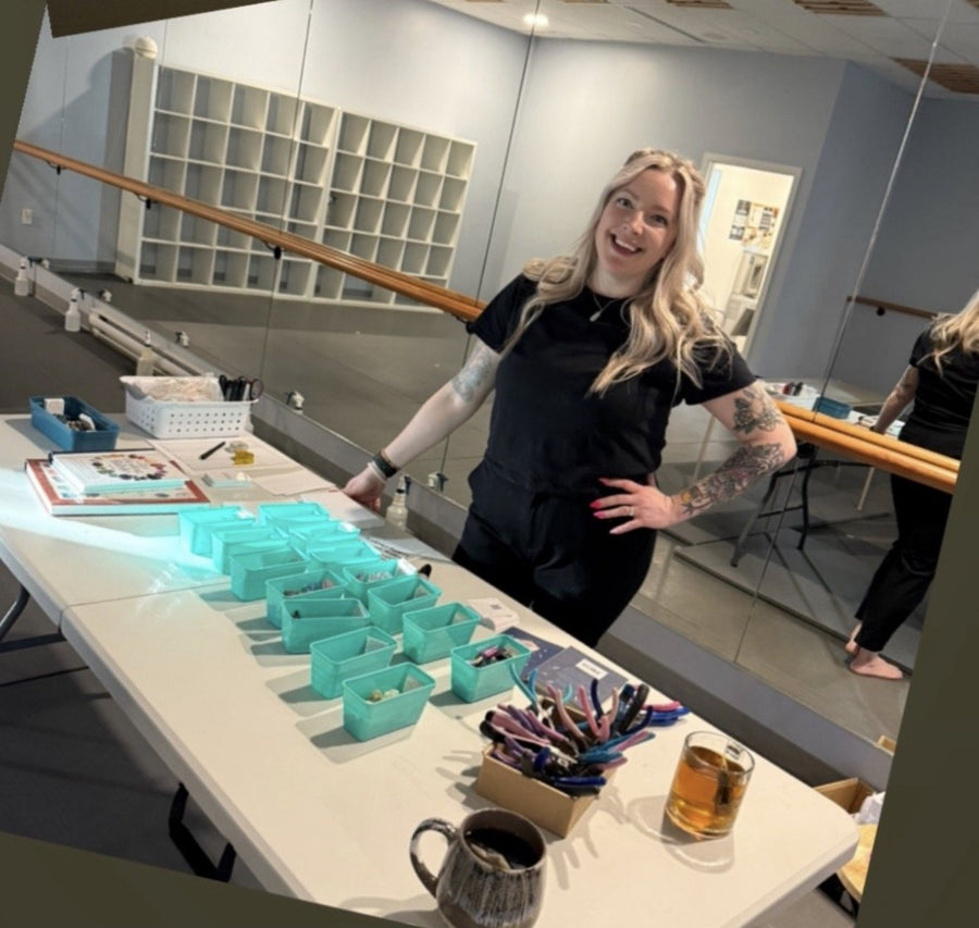 Laurie of Wholehearted Crystal Creations setting up a crystal necklace workshop