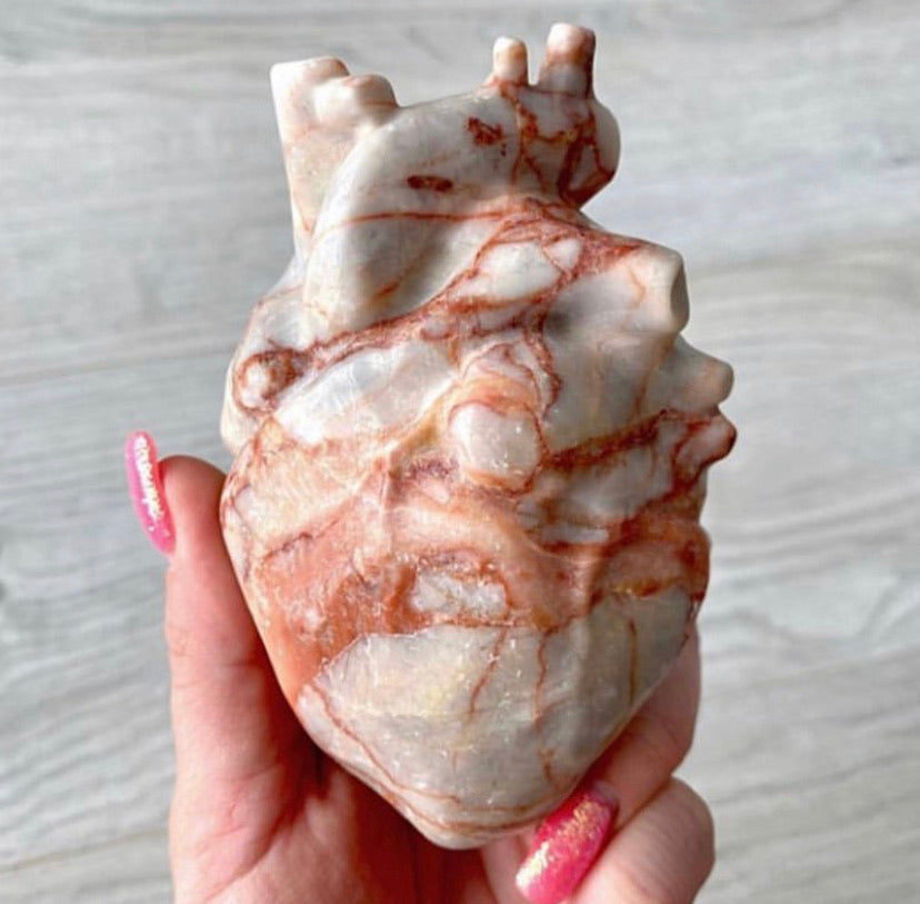 Pork stone (red banded calcite) anatomical heart carving